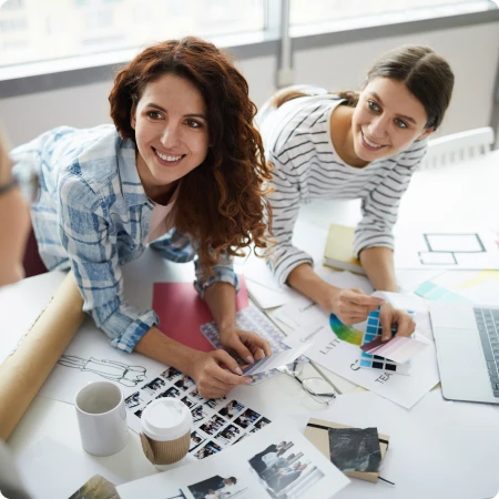 Female coworkers collaborating on a design project